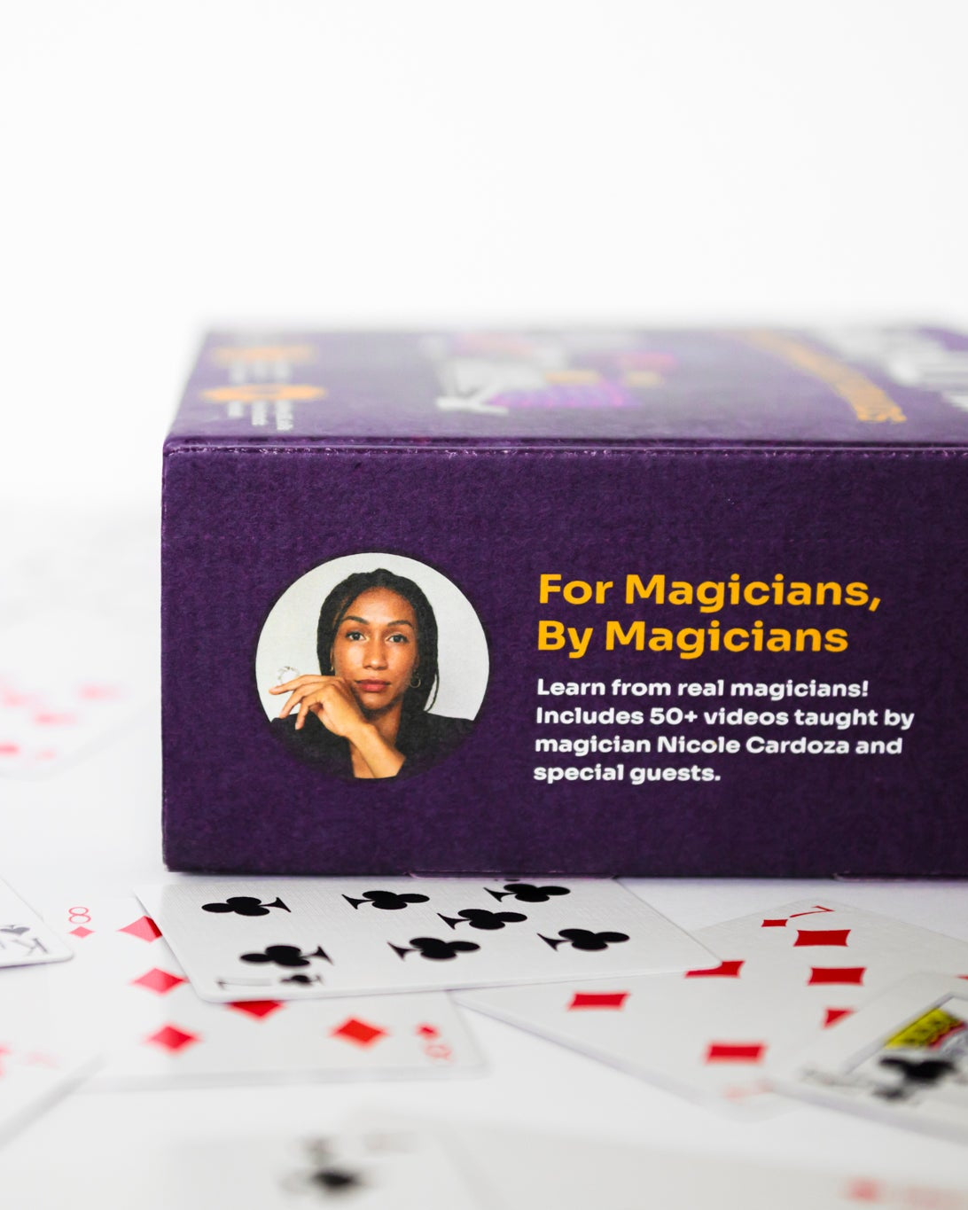 Close‑up of Magically Me Kids Magic Kit box side featuring a portrait of Magician Nicole Cardoza, tagline ‘For magicians, by magicians,’ and call‑out for 50+ video tutorials taught by Nicole Cardoza and special guests